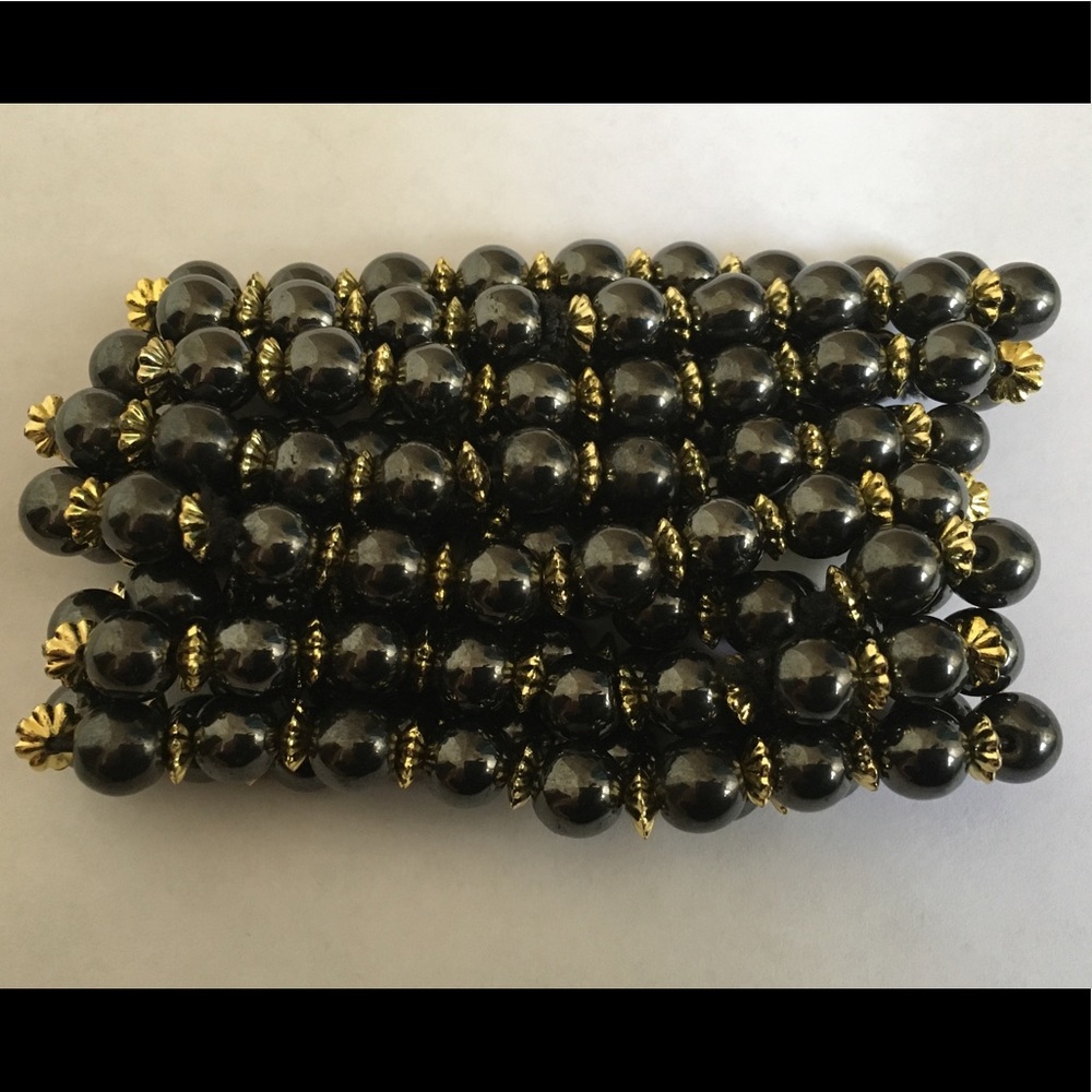 Seven Hematite And Gold Bracelets